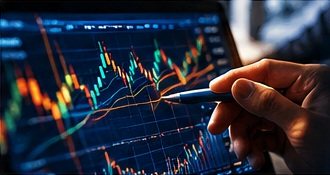 A hand pointing a stylus at a candlestick chart on a tablet