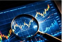 A magnifying glass over a price chart